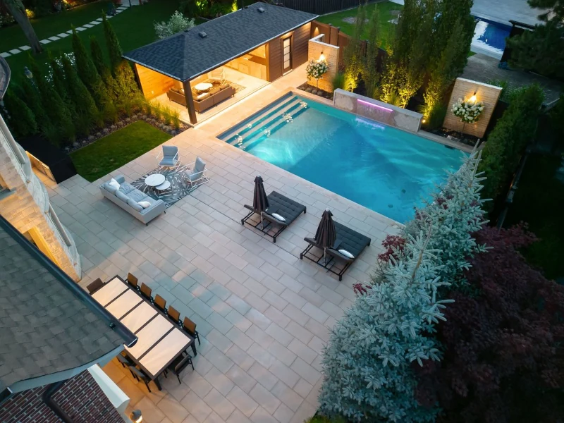 wood and metal backyard studio with entrance lighting