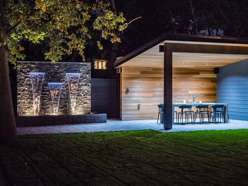 mainly wood backyard studio with windows and sliding doors