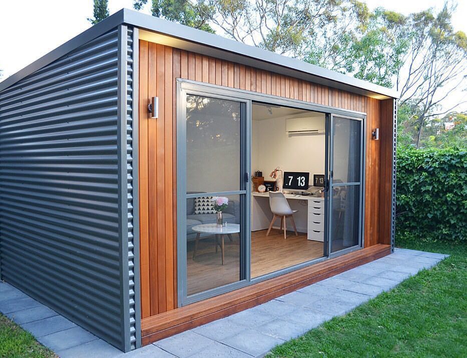 wood and metal backyard studio with sliding doors