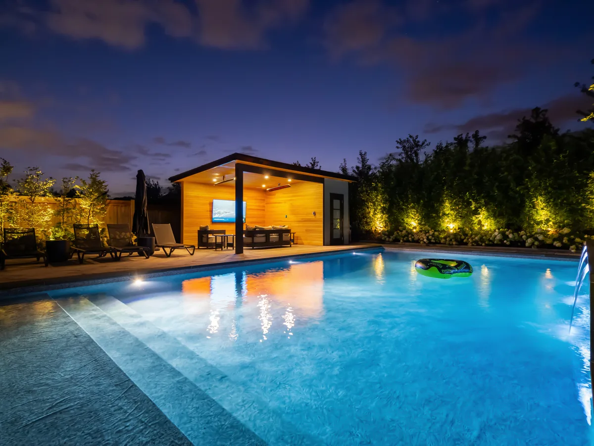 Ontario backyard designed for four-season use with covered seating and lighting