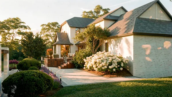 Brule landscape design render &mdash; Approach to the house in late afternoon — sunken hot tub terrace, boxwood spheres and white hydrangeas