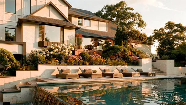 Brule landscape design render &mdash; Loungers along the pool deck at golden hour above the spill edge, planting beds behind