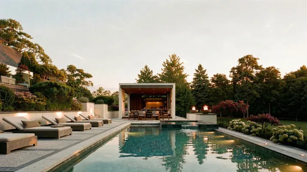 Brule landscape design render &mdash; Looking down the pool to the lit cabana at dusk, deck lights, pool lights and fire bowls on