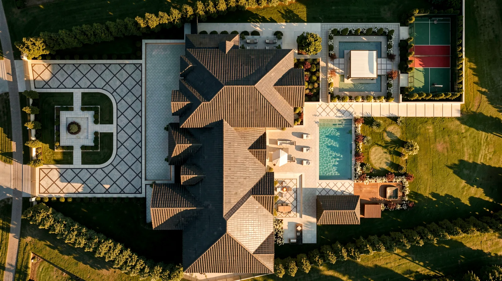Aerial plan view of the Meadow Wood estate showing the pool, sports court and formal front courtyard