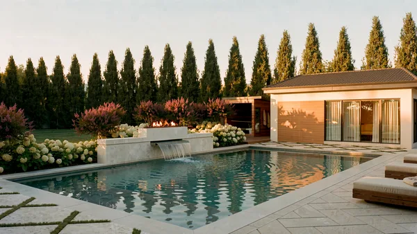 Meadow Wood pool with its water feature wall and cabana