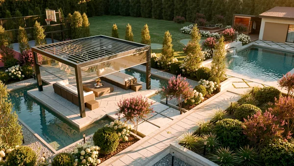 Aerial view of the Meadow Wood louvered pergola lounge beside the pool