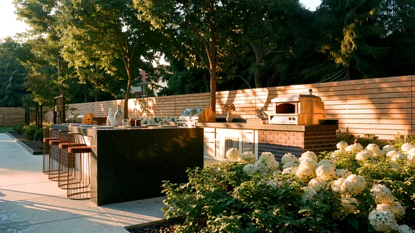 Waymar landscape design render &mdash; Kitchen island wrapped in hydrangeas at golden hour