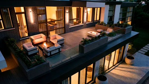 Waymar landscape design render &mdash; Upper terrace lounge overlooking the lit courtyard at night