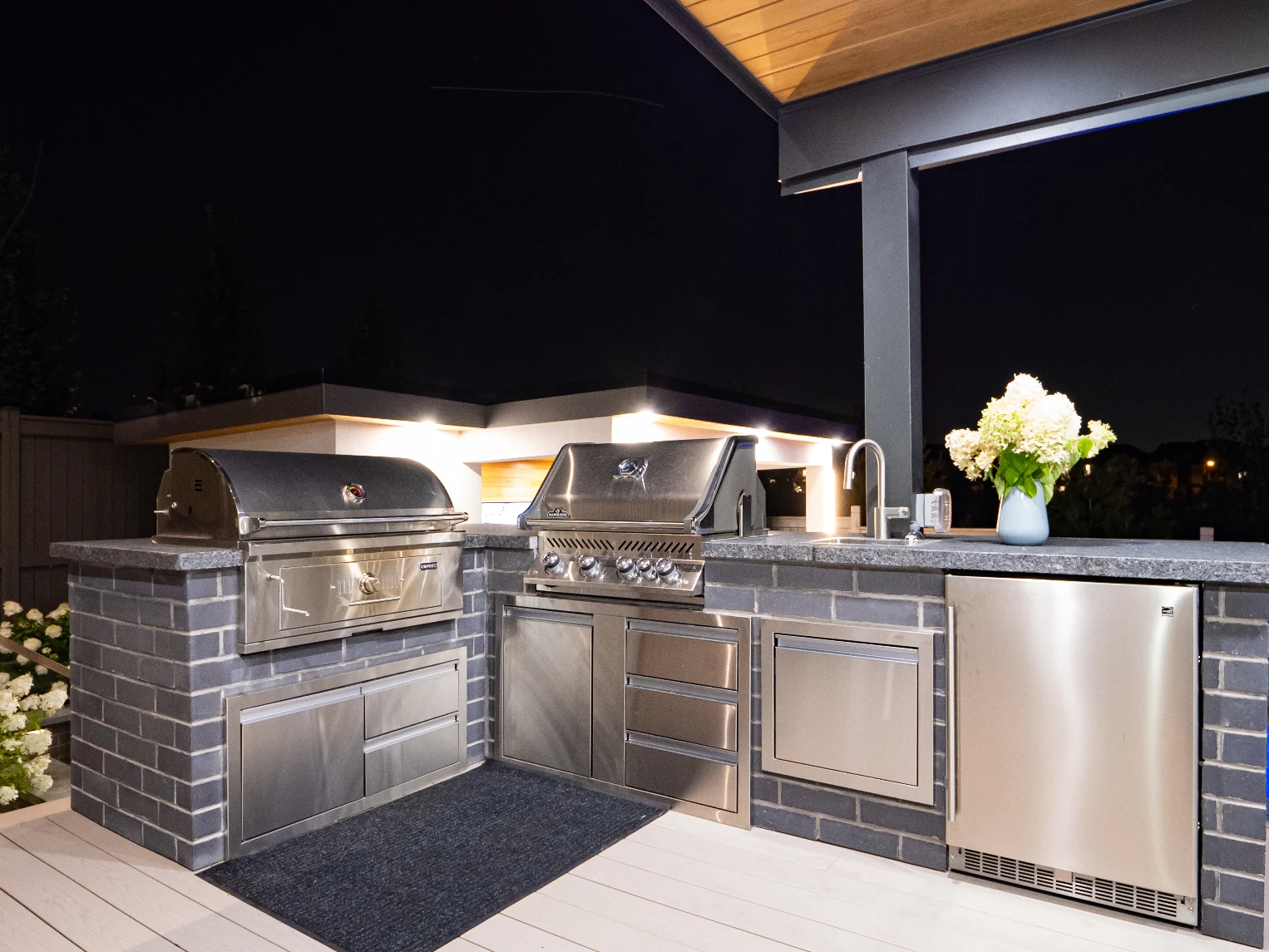 outdoor kitchen with angled roof and ceiling fans