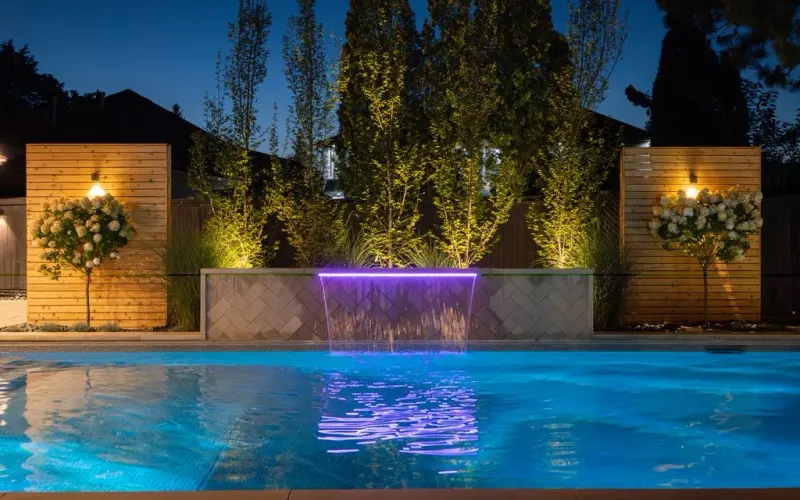 Steel-vinyl pool with a lit water feature