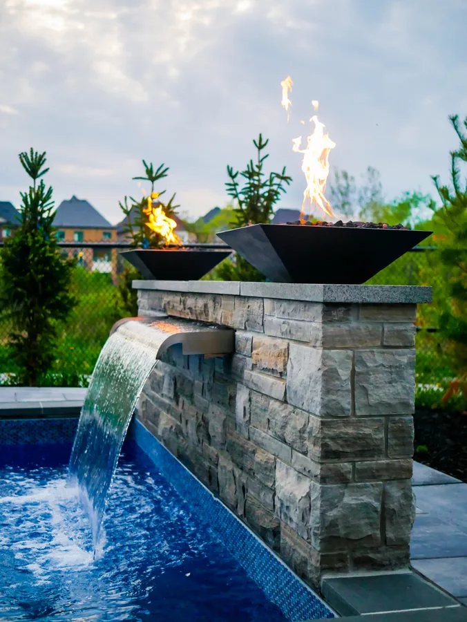 backyard pool with water feature
